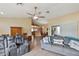 Comfortable living room featuring a ceiling fan, tile flooring, and slider to the porch at 1039 Sandhill St, Groveland, FL 34736