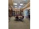 Community library with ample seating and bookshelves at 5206 Fantasy Way, Leesburg, FL 34748