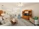 Large living area featuring modern furnishings, neutral colors, and ample space for entertaining at 5206 Fantasy Way, Leesburg, FL 34748