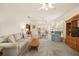 Spacious living room with a dining area, neutral decor, and plenty of seating options at 5206 Fantasy Way, Leesburg, FL 34748