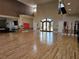 A spacious community meeting room with hardwood floors at 5206 Fantasy Way, Leesburg, FL 34748