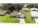 Aerial view of a single Gathering home with mature trees and a well maintained lawn at 6410 Tildon Ct, Leesburg, FL 34748