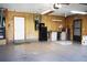 Attached garage with pegboard walls and workbench at 6410 Tildon Ct, Leesburg, FL 34748