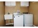 Well-equipped laundry room, including washer and dryer at 6410 Tildon Ct, Leesburg, FL 34748