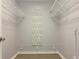 Large walk-in closet with wire shelving and shoe rack at 6410 Tildon Ct, Leesburg, FL 34748