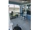 Relaxing front porch features a rocking chair and table, offering a cozy outdoor space at 104 Turtle Run, Umatilla, FL 32784