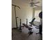 The room has a ceiling fan and weightlifting equipment at 104 Turtle Run, Umatilla, FL 32784