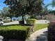 Landscaped front yard with a walkway leading to the house entrance at 10544 Via De Robina Ct, Clermont, FL 34711