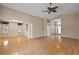 Large living room with hardwood floors and an open floor plan, blending living and dining spaces at 1401 Valparaiso St, The Villages, FL 32162