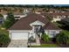 Charming single-Gathering home with an attached garage, a beautiful entry, and verdant landscaping at 1622 Carrera Dr, The Villages, FL 32159