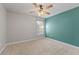 Carpeted bedroom with a window, ceiling fan, and a neutral palette for personalization at 24126 Plymouth Hollow Cir, Sorrento, FL 32776