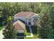 Lovely two-story home with a landscaped front yard and paved walkway leading to the entrance at 24126 Plymouth Hollow Cir, Sorrento, FL 32776