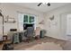 Office space with wood-look flooring, bright natural light, and unique decor at 24126 Plymouth Hollow Cir, Sorrento, FL 32776
