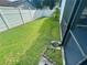 Large backyard with a white privacy fence and lush green grass at 1415 Harnden W Rd, Port Orange, FL 32129