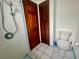 Bathroom area featuring shower, toilet, and closet in vintage design at 1415 Harnden W Rd, Port Orange, FL 32129