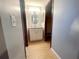 Bathroom featuring a vanity with storage, mirror and lighting at 1415 Harnden W Rd, Port Orange, FL 32129