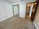 Bedroom featuring carpeted floors, closet, and neutral paint at 1415 Harnden W Rd, Port Orange, FL 32129