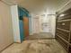 Garage featuring built-in storage cabinets, utility sink and overhead door opener at 1415 Harnden W Rd, Port Orange, FL 32129