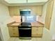 Charming kitchen featuring an updated oven and view to the backyard pool at 1415 Harnden W Rd, Port Orange, FL 32129