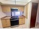 Charming kitchen featuring an updated oven and view to the backyard pool at 1415 Harnden W Rd, Port Orange, FL 32129