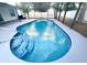 Inviting screened-in pool featuring tiled steps and a convenient pool ladder at 1415 Harnden W Rd, Port Orange, FL 32129