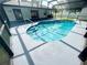 Inviting outdoor pool with patio, in a screened-in enclosure at 1415 Harnden W Rd, Port Orange, FL 32129