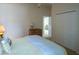 Bedroom with double bed, dresser, and access to another room at 1750 Kingfisher Ct, The Villages, FL 32162