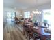 Dining room with wood table, chairs, and chandelier at 1750 Kingfisher Ct, The Villages, FL 32162