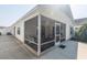 Screened porch with seating area, perfect for relaxing outdoors at 1750 Kingfisher Ct, The Villages, FL 32162