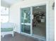 White sliding glass door leading to a patio and living area at 1750 Kingfisher Ct, The Villages, FL 32162