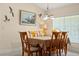 Bright dining room with wood table and chairs, ready for Gathering meals at 209 Shannon Ln, Lady Lake, FL 32159