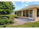 Back exterior view showing patio and screened porch at 209 Shannon Ln, Lady Lake, FL 32159