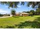 House with a well-maintained lawn and landscaping at 209 Shannon Ln, Lady Lake, FL 32159