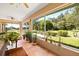 Relaxing screened porch with plenty of plants at 209 Shannon Ln, Lady Lake, FL 32159