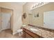 Bright bathroom featuring granite countertop and decorative accents at 4947 Ne 124Th Rd, Oxford, FL 34484