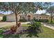 Well-maintained front yard with lush landscaping at 4947 Ne 124Th Rd, Oxford, FL 34484