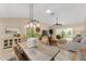 Open concept dining area with a view into the living room at 410 Ainsworth Cir, The Villages, FL 32162
