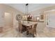 Elegant dining area with a wood table and wicker chairs at 410 Ainsworth Cir, The Villages, FL 32162