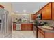 Modern kitchen with stainless steel appliances and granite countertops at 410 Ainsworth Cir, The Villages, FL 32162