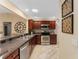 Modern kitchen with stainless steel appliances and granite countertops at 410 Ainsworth Cir, The Villages, FL 32162