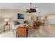 Open living area with a neutral color palette and access to the kitchen at 410 Ainsworth Cir, The Villages, FL 32162