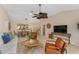 Relaxing living room, featuring a TV and comfortable seating area at 410 Ainsworth Cir, The Villages, FL 32162