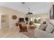 Bright and airy living room with sliding glass doors to a lanai at 410 Ainsworth Cir, The Villages, FL 32162
