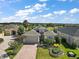 Single-Gathering home with paver driveway, landscaping, and a view of the neighborhood at 8732 Providence Ct, Mount Dora, FL 32757