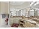 Elegant bathroom with double vanity and granite countertop at 8732 Providence Ct, Mount Dora, FL 32757