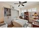 Guest bedroom with a Murphy bed and built-in shelving at 8732 Providence Ct, Mount Dora, FL 32757