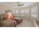 Spacious bedroom with two twin beds and window seating at 8732 Providence Ct, Mount Dora, FL 32757