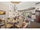Bright dining area with chandelier and seating for four at 8732 Providence Ct, Mount Dora, FL 32757
