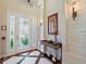 Elegant entryway with tile floors and stone accents at 8732 Providence Ct, Mount Dora, FL 32757