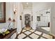 Bright hallway with tile flooring and views into other rooms at 8732 Providence Ct, Mount Dora, FL 32757